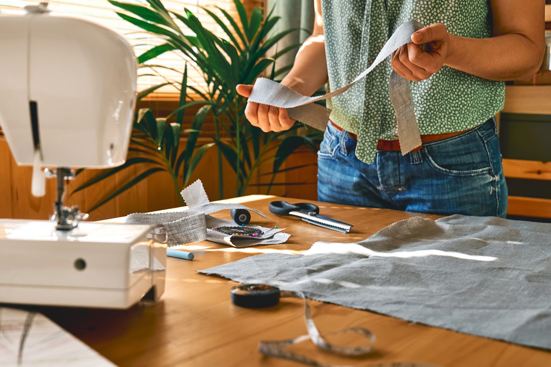 seamstress-sewing-on-the-sewing-machine-in-small-s-2025-03-09-02-58-22-utc-min.jpg