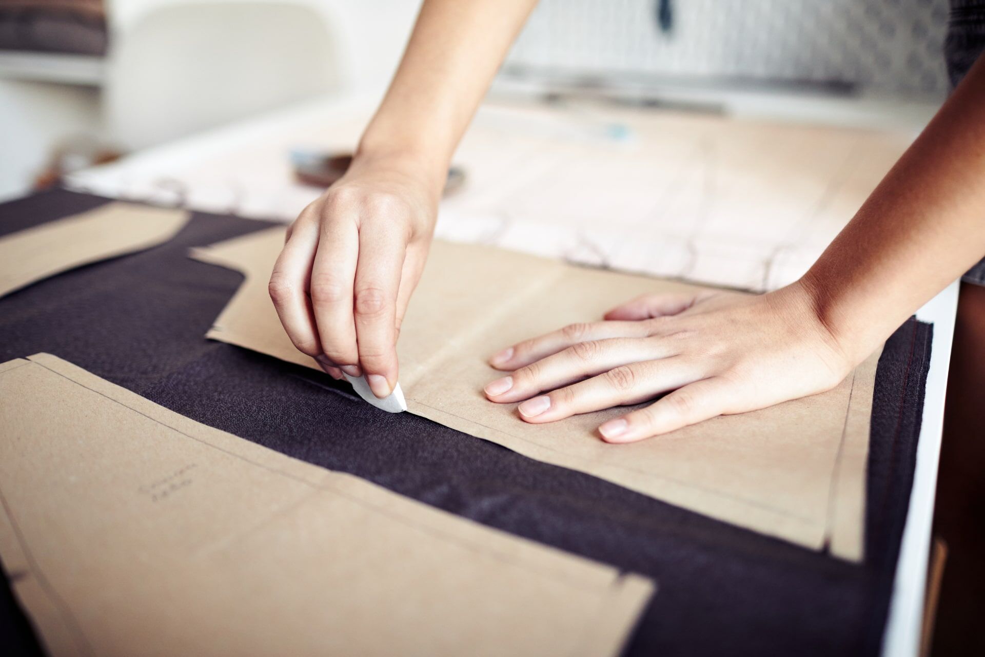 seamstress-outlining-cardboard-pattern-2025-03-08-02-30-41-utc-min.jpg